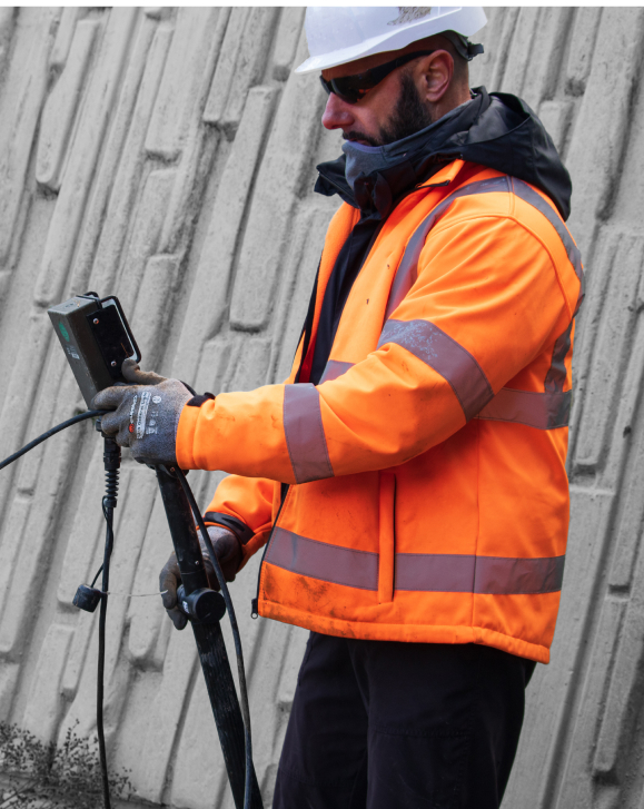 Man using survey equipment